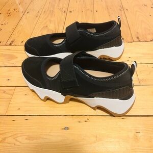 Women’s Black and White Sorel Mary Jane Sneakers